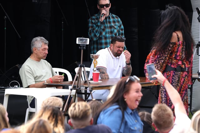 Action from the chilli eating event, won by Michael Hunt, left