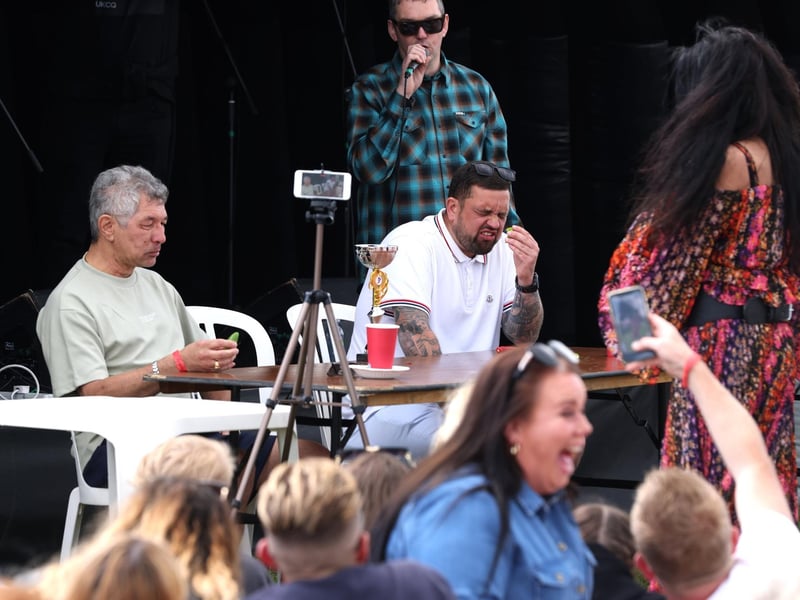 Action from the chilli eating event, won by Michael Hunt, left