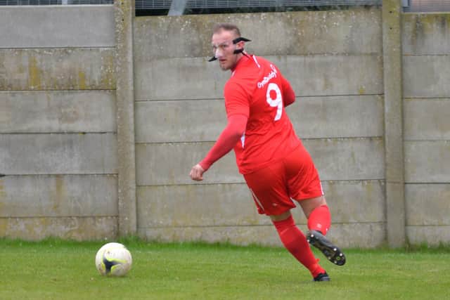 Connor Duffin playing in a face mask to protect a broken nose. The Horndean striker is the first Wessex League Premier Division striker to score 30 league and cup goals this season. Picture: Martyn White.