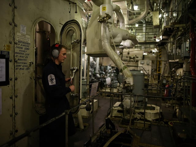 Crew member ETME Turnley seen working in the engine room onboard HMS Illustrious in May 10, 2013 Photo by Dan Kitwood/Getty Images