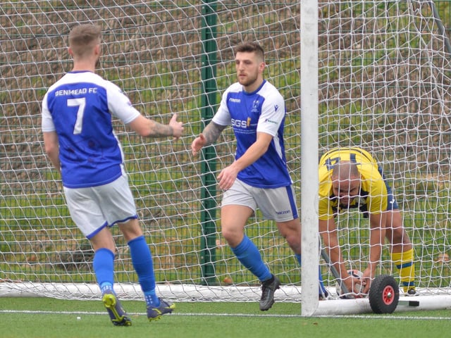 Ryan Chandler, middle, has just scored one of his two goals for Denmead. Picture by Martyn White