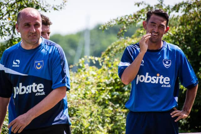 Paul Cook, left, alongside Gary Roberts during Pompey training in 2015