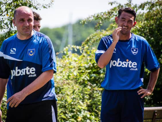 Paul Cook, left, alongside Gary Roberts during Pompey training in 2015
