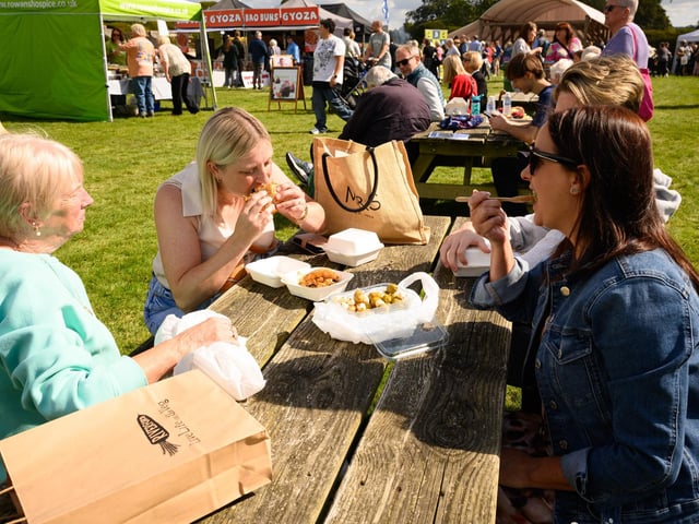 Pictured is: The Evans family enjoying the atmosphere and food at the South Downs Food Festival Picture: Keith Woodland (140921-52)