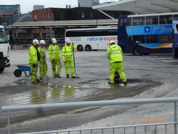 Workers sorting a temporary fix the tarmac at the £9.2m Hard Interchange at Portsea in October 2019. Picture: Terry Pearson