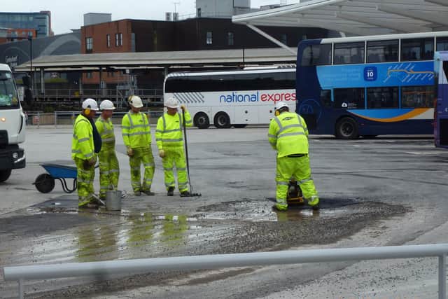 Workers sorting a temporary fix the tarmac at the £9.2m Hard Interchange at Portsea in October 2019. Picture: Terry Pearson