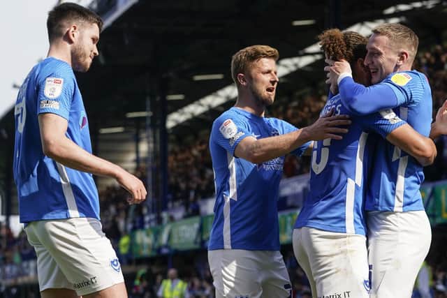Ronan Curtis, far right, gets the plaudits from his Pompey team-mates following his second goal in the Blues' win against Gillingham at Fratton Park