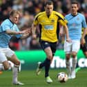 Justin Bennett, pictured (yellow) in action for Gosport Borough in the 2014 FA Trophy final, has scored 49 league and cup goals for Bemerton this season.
Picture: Dave Haines