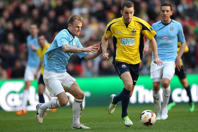 Justin Bennett, pictured (yellow) in action for Gosport Borough in the 2014 FA Trophy final, has scored 49 league and cup goals for Bemerton this season.
Picture: Dave Haines