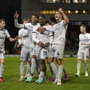 Pompey's players celebrate Christian Saydee's first-half goal at Leyton Orient in the Bristol Street Motors Trophy. Picture: Jason Brown/ProSportsImages