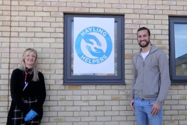 Portsmouth player Christian Burgess visited Hayling Island to help the staff and coaches from Heart of Hayling Boxing Academy deliver prescriptions to people in the community. Pictured: Wendy Ball, who set up the Hayling Helpers, with Christian Burgess