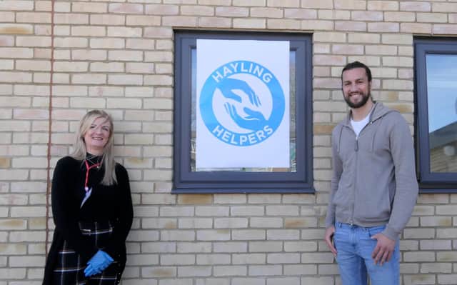 Portsmouth player Christian Burgess visited Hayling Island to help the staff and coaches from Heart of Hayling Boxing Academy deliver prescriptions to people in the community. Pictured: Wendy Ball, who set up the Hayling Helpers, with Christian Burgess