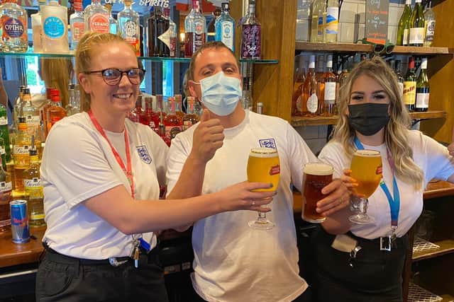 From left, team leader Harley OBrien, manager Roy Wolstenholme and team leader Trish Ionescu at the Portsbridge pub in Cosham this afternoon ahead of the England-Denmark Euro 2020 semi-final 
Picture: Tom Cotterill