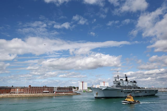 The helicopter carrier HMS Illustrious departs Portsmouth for a deployment to the Mediterranean on August 12, 2013 in Portsmouth. Photo by Oli Scarff/Getty Images