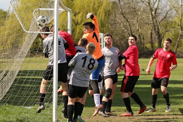 AFC Prospect Farm Rangers (red/black) score against Milton Park Rangers. Picture: Kevin Shipp