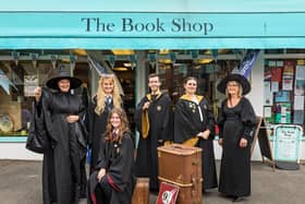 Sarah Veal (48), Jazmine Woodward (22), Kieran Slade (18), Shania Erdman (24), Barbara Veal (74) and Jessica Elshaw (16, seated) prepare for Harry Potter night outside of the outside of The Book Shop in Lee-On-The-Solent. Picture: Mike Cooter (240621)