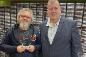 Tony Smith, left, receives his Community Media Champion Award. Picture by Angel Radio