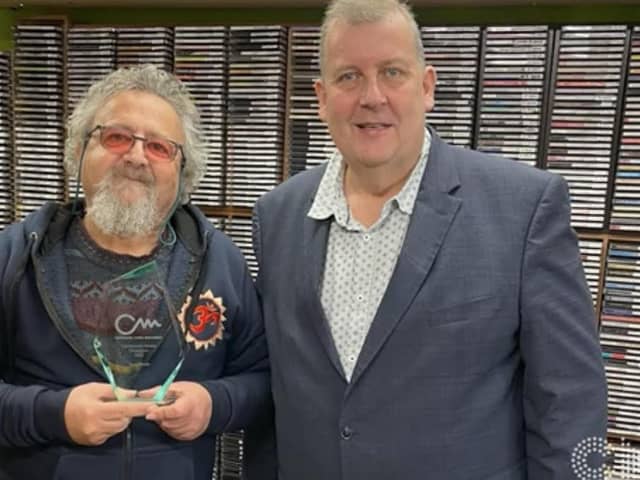 Tony Smith, left, receives his Community Media Champion Award. Picture by Angel Radio