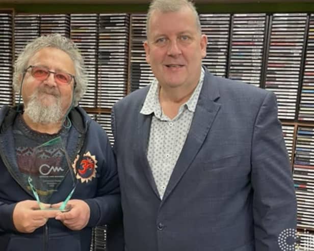 Tony Smith, left, receives his Community Media Champion Award. Picture by Angel Radio
