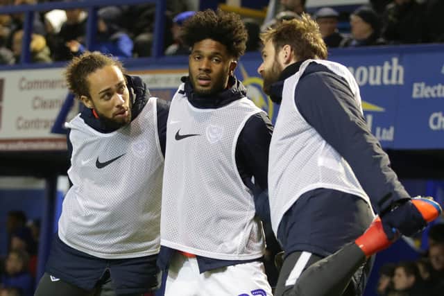 From left: Marcus Harness, Ellis Harrison and Brett Pitman warm up during Friday night's 3-0 win against Rochdale. Picture: Robin Jones/Getty Images