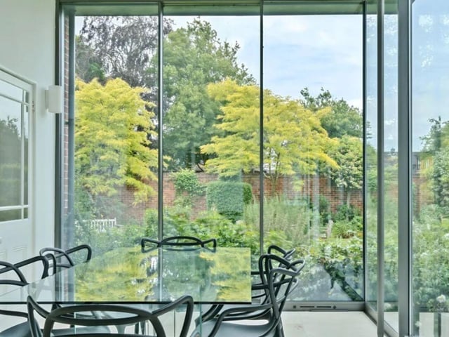 The listing says: "From the moment you step into the grand entrance hall, you are greeted by exquisite character features that seamlessly blend with modern amenities. The property boasts three reception rooms ideal for entertaining, a pantry and utility room for convenience, and a bespoke fitted kitchen overlooking the lush grounds."