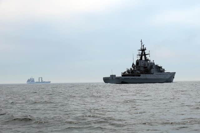 HMS Mersey, pictured front right, with the Russian tanker Akademik Pashin, left