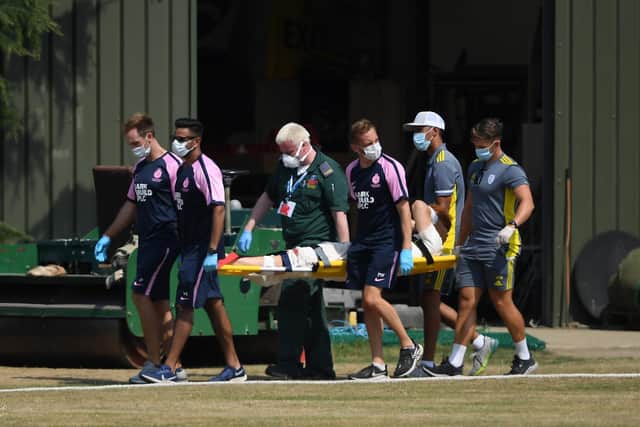 Ryan Stevenson  is stretchered off after colliding with a marquee. Photo by Alex Davidson/Getty Images.