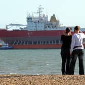 HMS Endurance moored in the solent off Gosport's Stokes Bay in 2009 piggy-back on the heavy lifting vessel Viewed, Some ladies take a photo whilst walking their dog

PICTURE: PAUL JACOBS (091303-1)