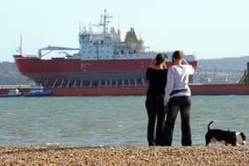 HMS Endurance moored in the solent off Gosport's Stokes Bay in 2009 piggy-back on the heavy lifting vessel Viewed, Some ladies take a photo whilst walking their dog

PICTURE: PAUL JACOBS (091303-1)