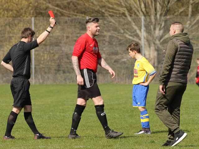 Neville Farley is shown the red card during Wymering's Mid-Solent League draw with Division 1 leaders Meon Milton. Picture: Kevin Shipp.