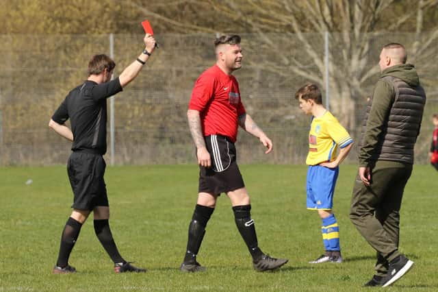 Neville Farley is shown the red card during Wymering's Mid-Solent League draw with Division 1 leaders Meon Milton. Picture: Kevin Shipp.