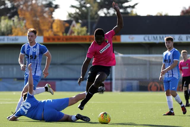 AFC Trades' Brendan Ebireri, right, evades a tackle from Billy Green. Picture: Chris Moorhouse