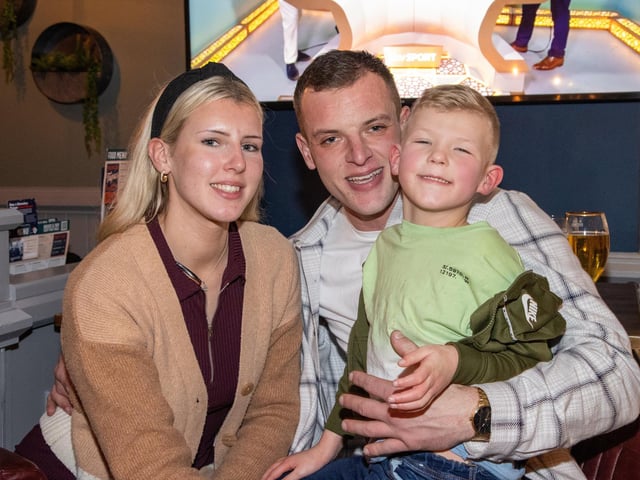 Pictured - Young England fan Reign, 6 with his Mum and Dad. Photos by Alex Shute.