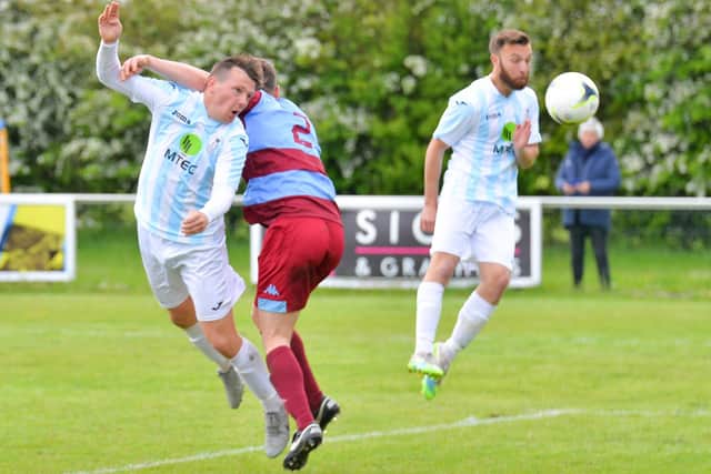 Callum Glen challenges for a header against Hamworthy. Picture: Martyn White.