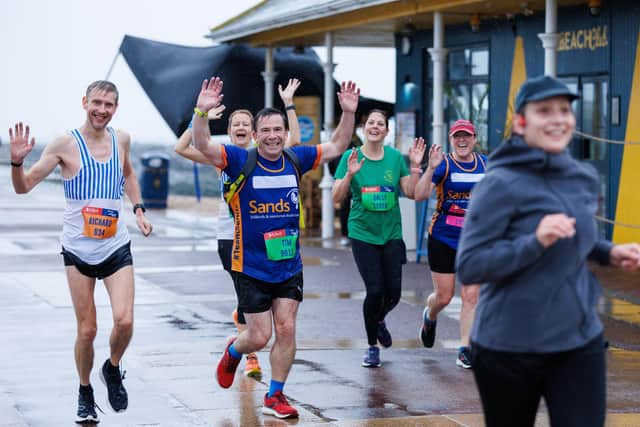 Runners hit the streets in wet and windy conditions despite The Great South Run being cancelled.