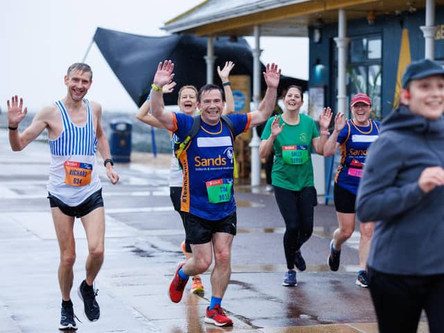Runners hit the streets in wet and windy conditions despite The Great South Run being cancelled.