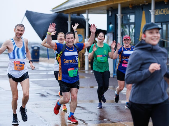 Runners hit the streets in wet and windy conditions despite The Great South Run being cancelled.