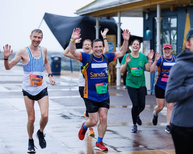 Runners hit the streets in wet and windy conditions despite The Great South Run being cancelled.