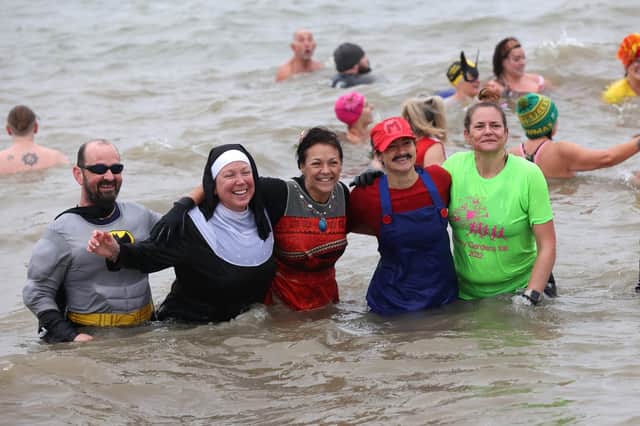 The hundreds of swimmers dressed up as their favourite characters, including Batman, Super-Mario and a nun