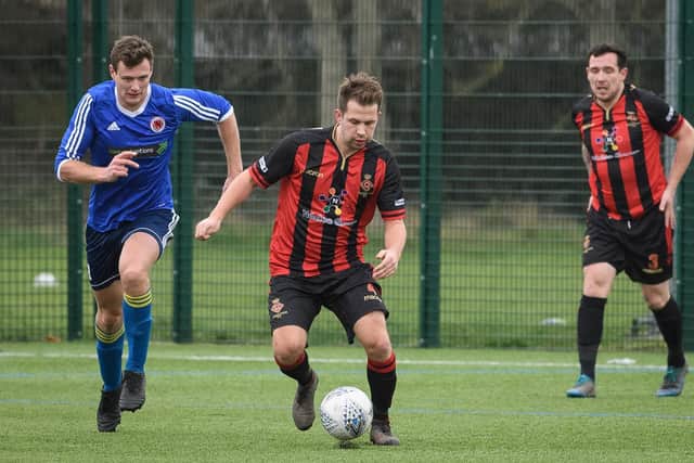 Fleetlands' Sam Martin (stripes) scored his side's winning penalty in last night's Wessex League Cup win over higher tier Blackfield & Langley. Picture: Keith Woodland