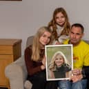 Sophie's Legacy has launched its annual Christmas Appeal for 2023. 
Pictured: Sophie's family, Lucy 16, Amelia 10, Gareth and Charlotte Fairall with a picture of Sophie at their home in Stubbington on Monday 12th December 2022

Picture: Habibur Rahman