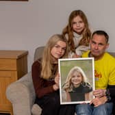 Sophie's Legacy has become a huge part of the community since it was established. 
Pictured: Sophie's family, Lucy 16, Amelia 10, Gareth and Charlotte Fairall with a picture of Sophie at their home in Stubbington on Monday 12th December 2022

Picture: Habibur Rahman
