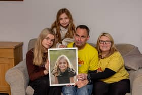 Sophie's Legacy has become a huge part of the community since it was established. 
Pictured: Sophie's family, Lucy 16, Amelia 10, Gareth and Charlotte Fairall with a picture of Sophie at their home in Stubbington on Monday 12th December 2022

Picture: Habibur Rahman