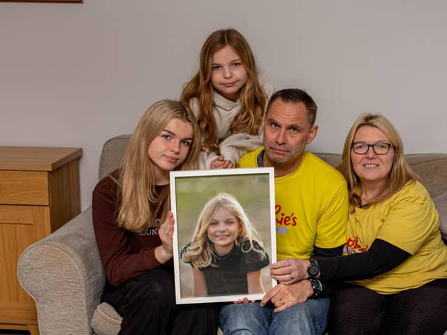 Sophie's Legacy has become a huge part of the community since it was established. 
Pictured: Sophie's family, Lucy 16, Amelia 10, Gareth and Charlotte Fairall with a picture of Sophie at their home in Stubbington on Monday 12th December 2022

Picture: Habibur Rahman