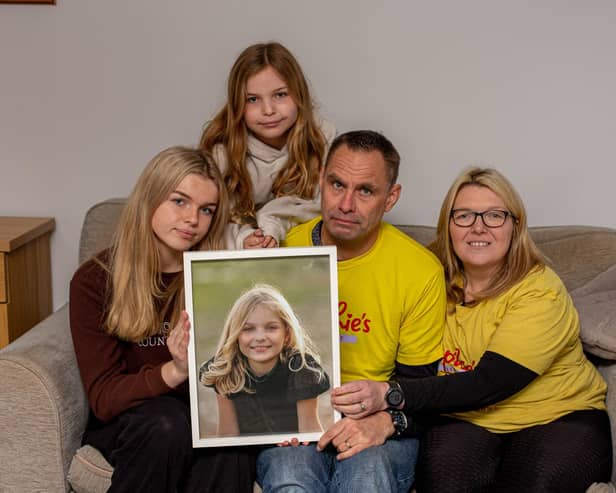Sophie's Legacy has launched its annual Christmas Appeal for 2023. 
Pictured: Sophie's family, Lucy 16, Amelia 10, Gareth and Charlotte Fairall with a picture of Sophie at their home in Stubbington on Monday 12th December 2022

Picture: Habibur Rahman