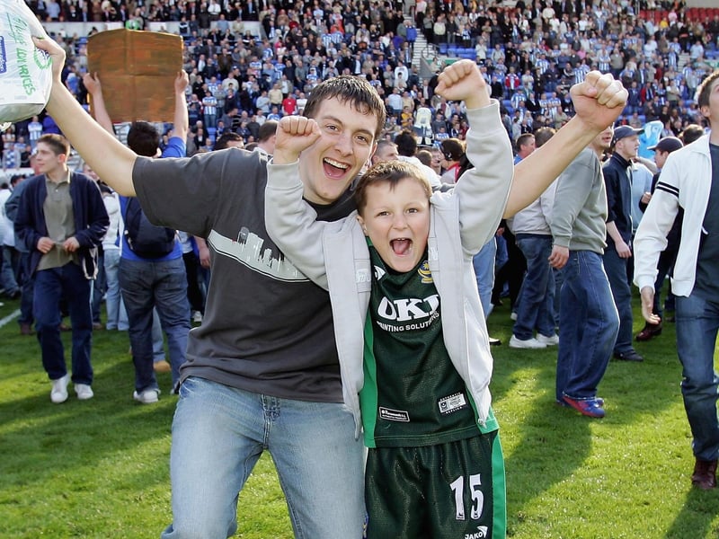 Pompey  fans celebrate after victory at Wigan in April 2006. Photo by Ross Kinnaird/Getty Images