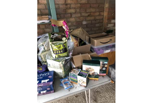 Mary Burgess, founder of Pet Connect UK, has set up the Pet Connect Pet Food Bank to help owners who are struggling to buy food for their pets. Pictured: Donations of food ready to be delivered
