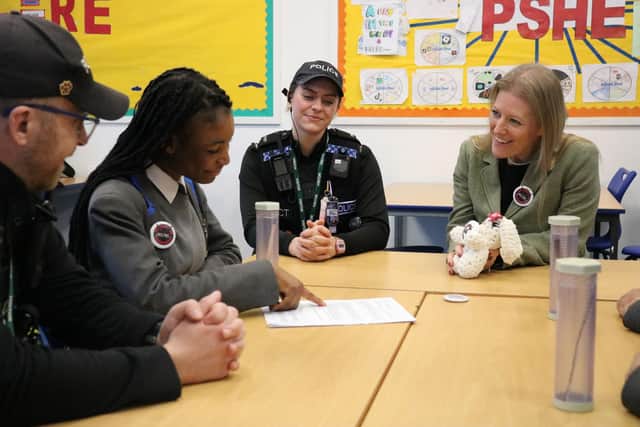 Donna Jones and police constables learning more about the app.