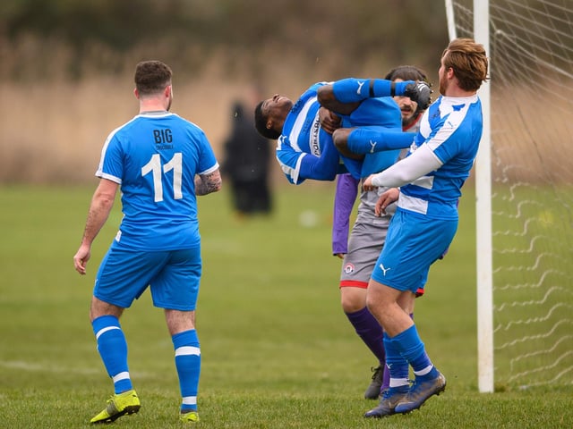 An AC Copnor player acrobatically celebrates a goal. Picture by Keith Woodland