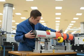 A BAE Systems employee with the Archerfish mine neutralisation system, designed at the company's munitions factory in Hilsea